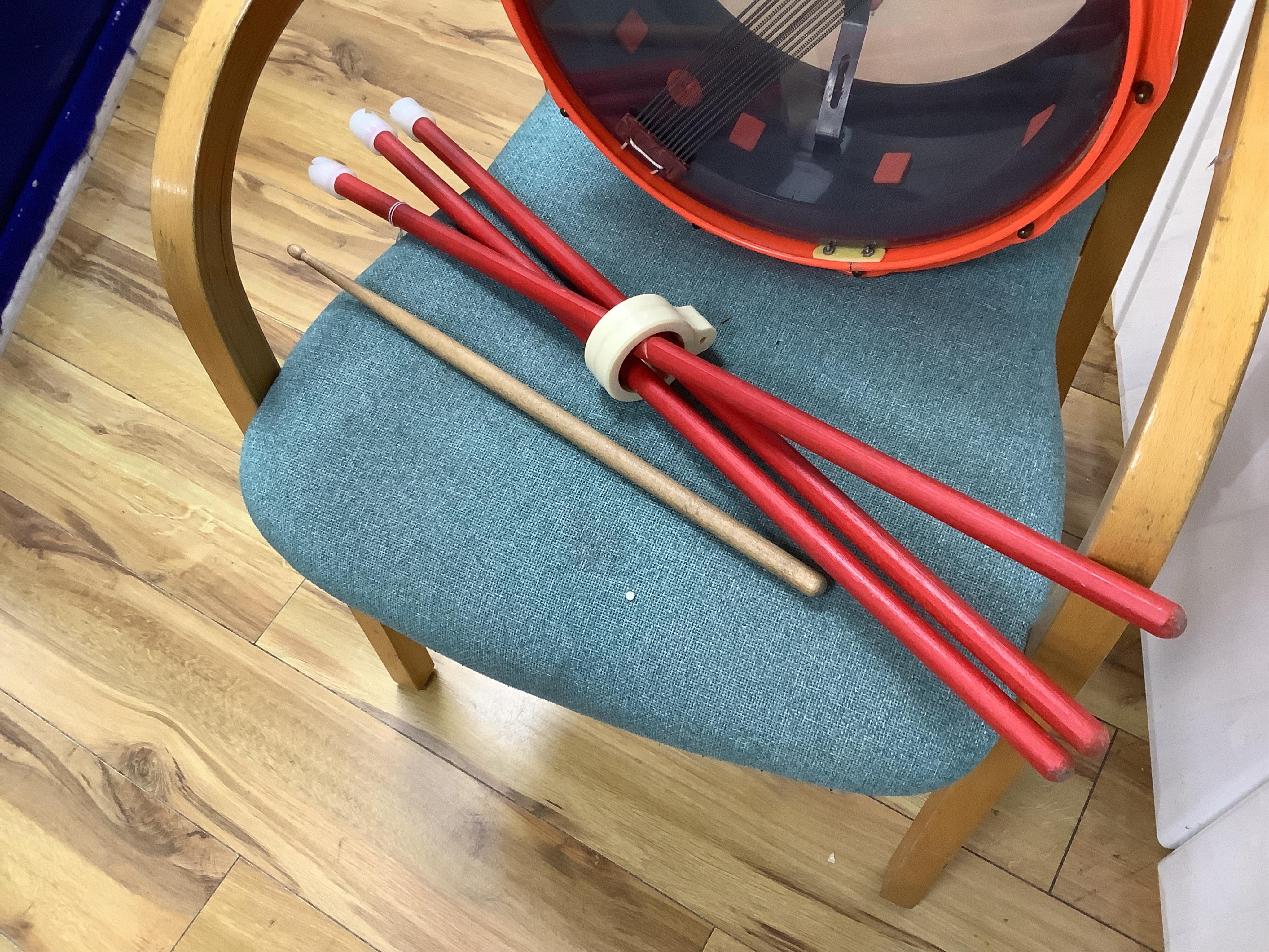 A 1960's Beatles child's plastic drum set in the original card box comprising of a snare drum on a stand, a card cut out bust of Ringo Starr, two 1960s Beatles jigsaws (unchecked) and a Beatles inflatable ball